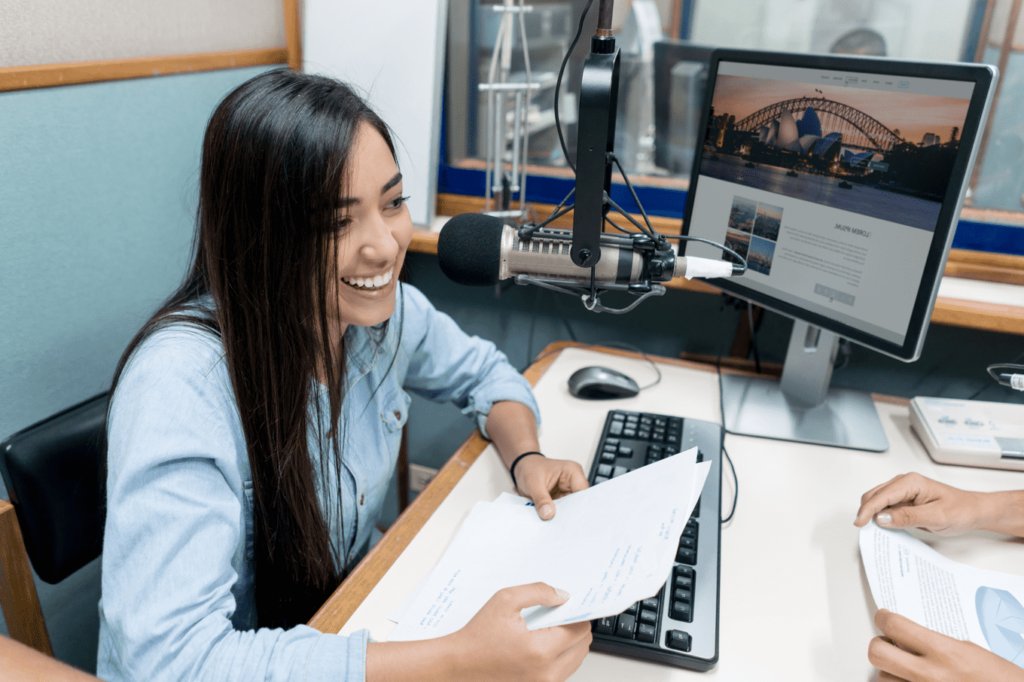 Student interviewing someone across a desk from her