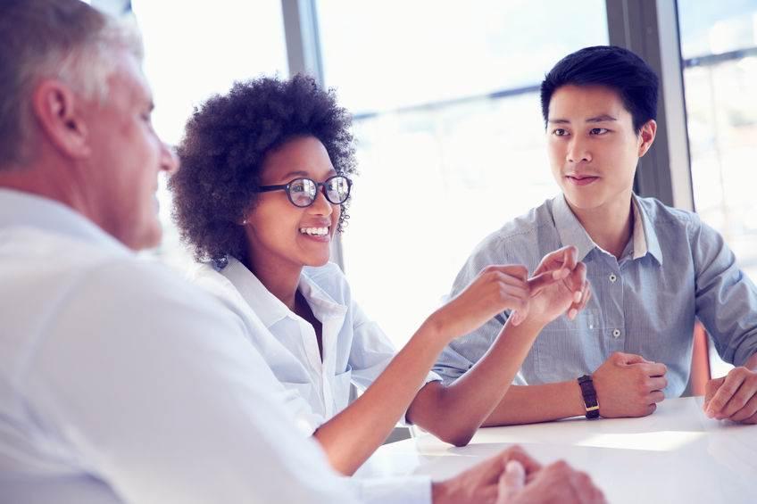 Three business professionals working together