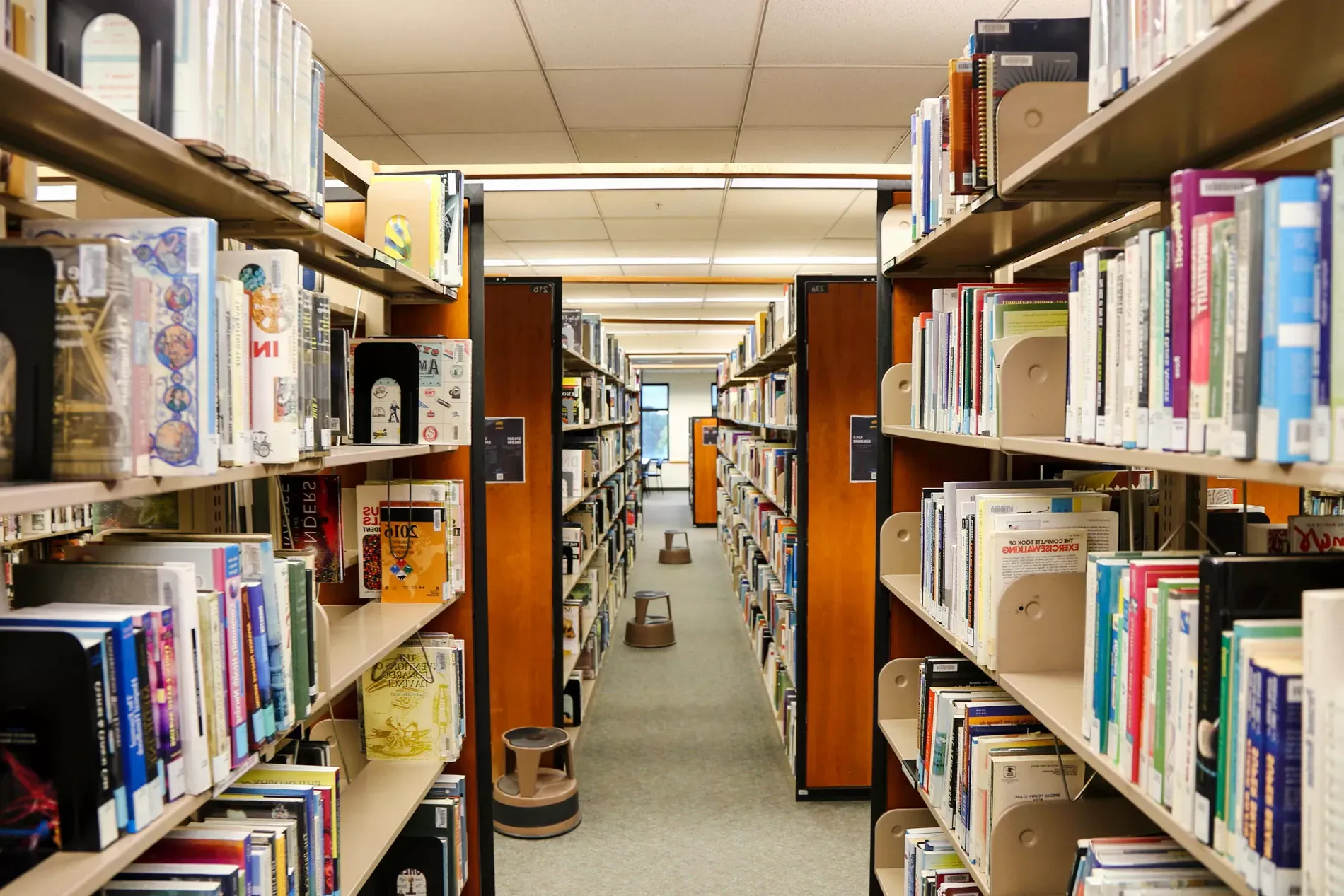 rows of bookshelves in library